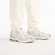 Мужские бежевые спортивные брюки New Balance Reimagined Graphic 48 (M) (MB62S1NTAGA) - изображение 6