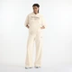 Женские бежевые спортивные брюки New Balance Trackside French Terry 38 (M) (WB62412FLIT) - изображение 2