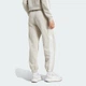 Женские джоггеры Essentials 3-Stripes Fleece Loose-Fit adidas JX7697 (2XS) бежевый (4068807269705) - изображение 2