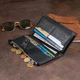Жіночий гаманець ST Leather з натуральної шкіри чорний вертикальний для карт на хлястику з кнопкою 19х9х1 7 см 56542 - зображення 10