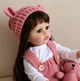 Реалістична лялька Reborn Bebe 55 см | М’яке тіло та рожевий комбінезон - изображение 5