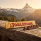 Шоколад молочний Toblerone 100 г швейцарський з медом мигдальною нугою горіхами фігурний плитка солодощі десерт - зображення 5
