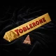 Шоколад молочний Toblerone 100 г швейцарський з медом мигдальною нугою горіхами фігурний плитка солодощі десерт - зображення 6