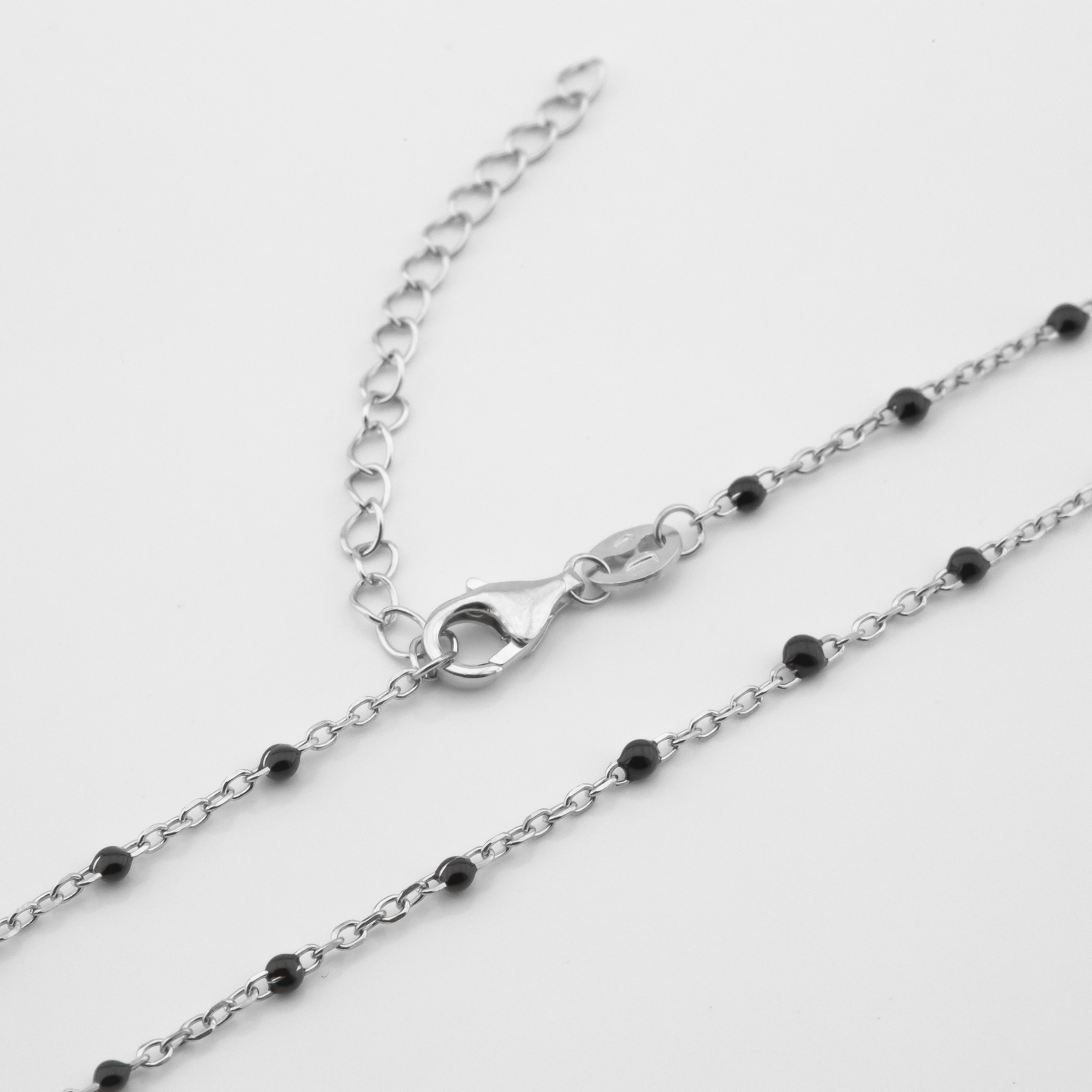 

Серебряная цепочка с им. оникса KO14429 Диамант, 40 размер