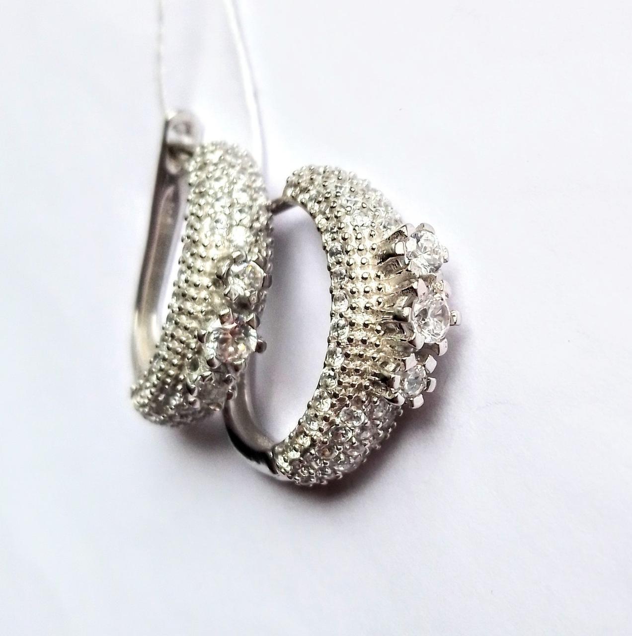 

Серебряные серьги корона с цирконом 043844