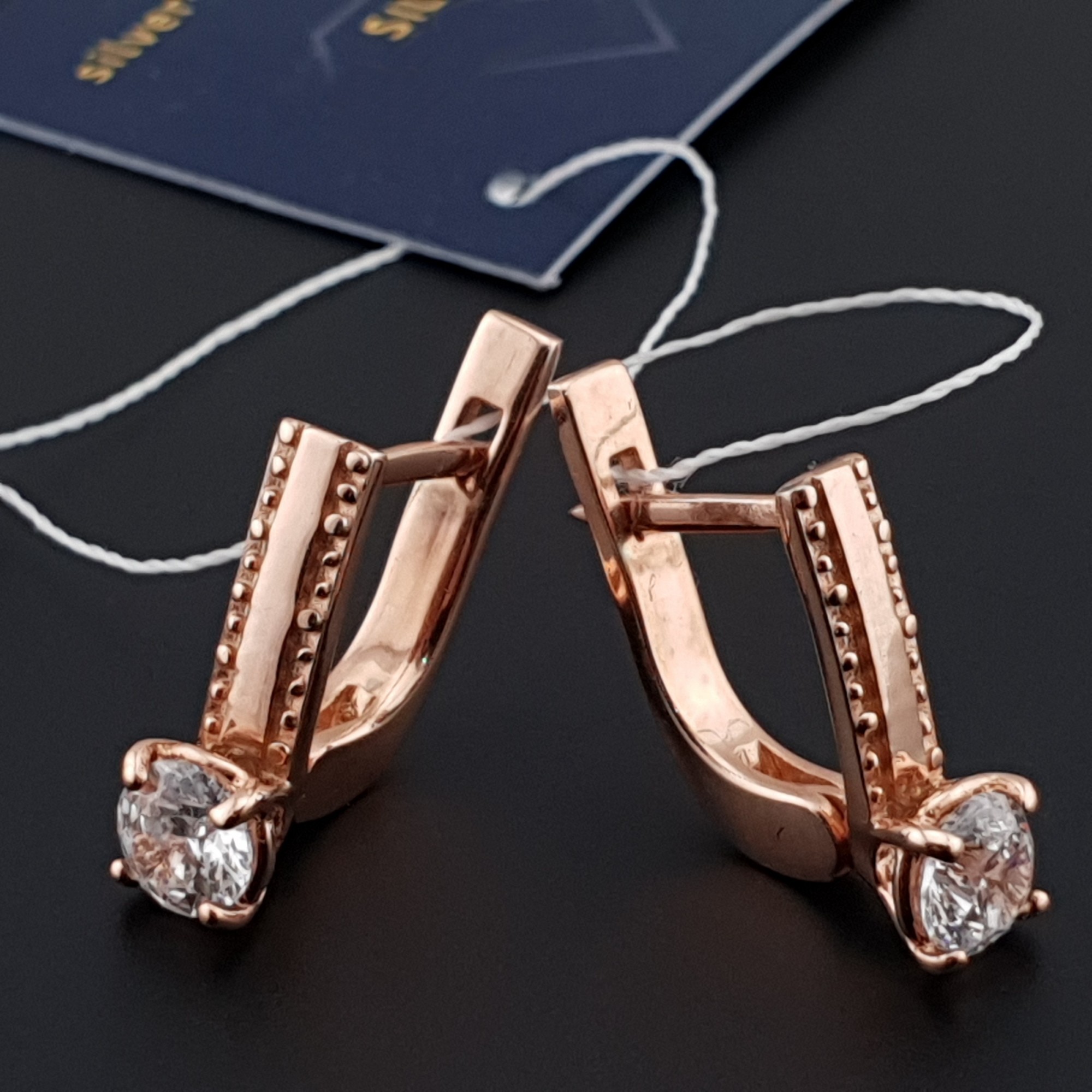 

Серебряные серьги позолоченные Silver с камнями на английской застежке Діана-сережки