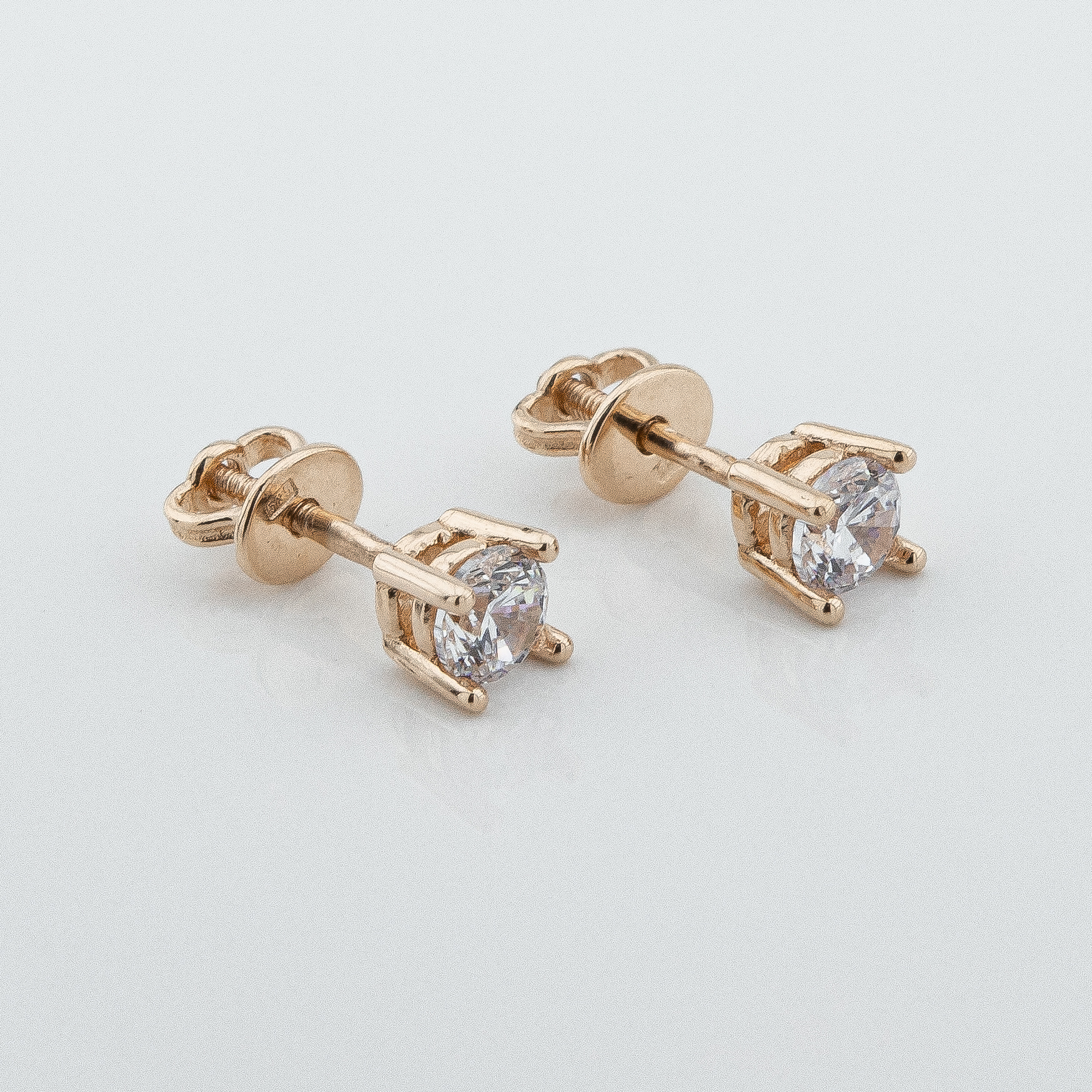 

Серьги-гвоздики с фианитами в красном золоте c121759 Диамант
