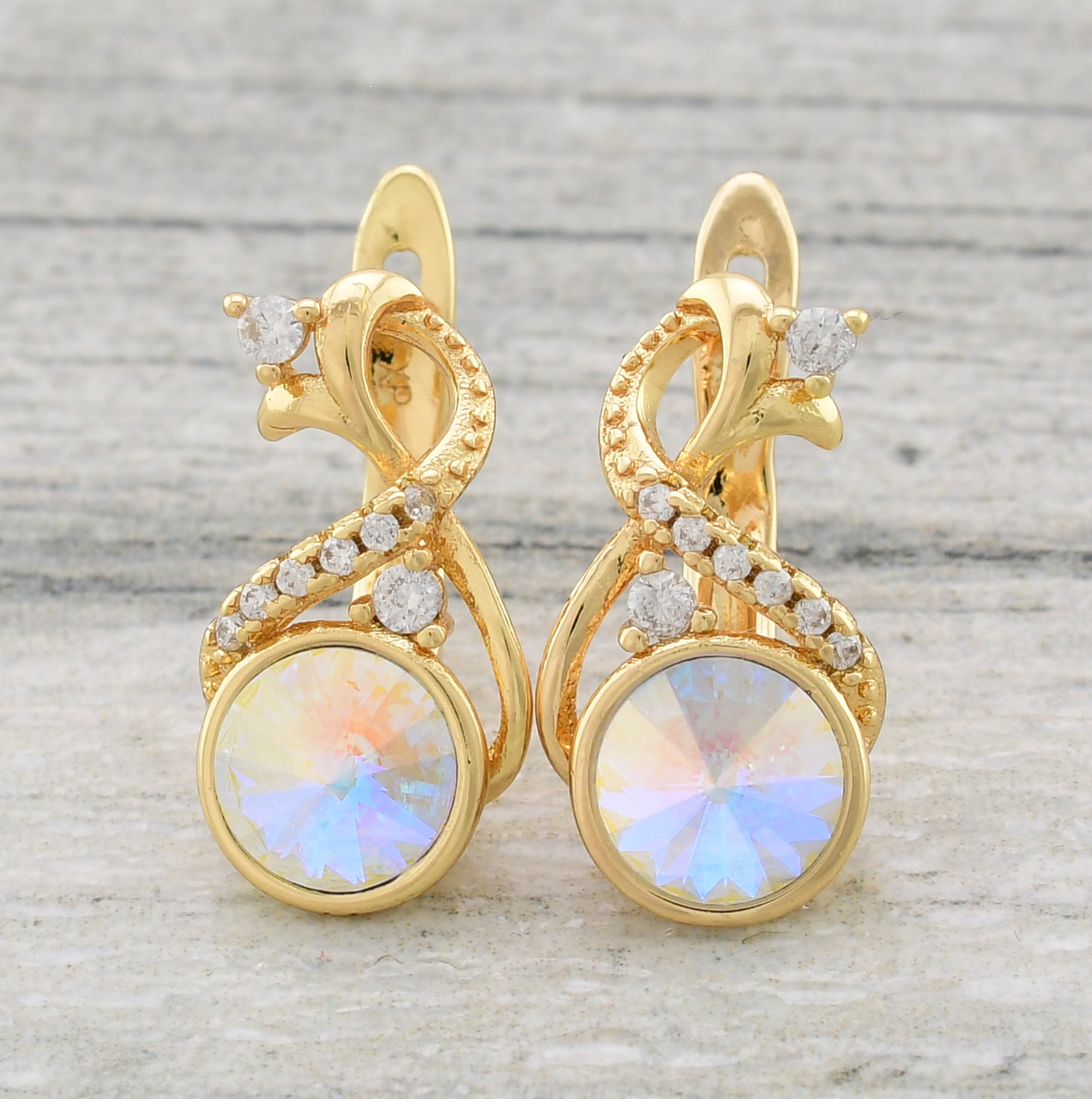 

Сережки Xuping з кристалами Swarovski 8305218К розмір 17х9 мм колір світанковий вага 2.5 г позолота 18К