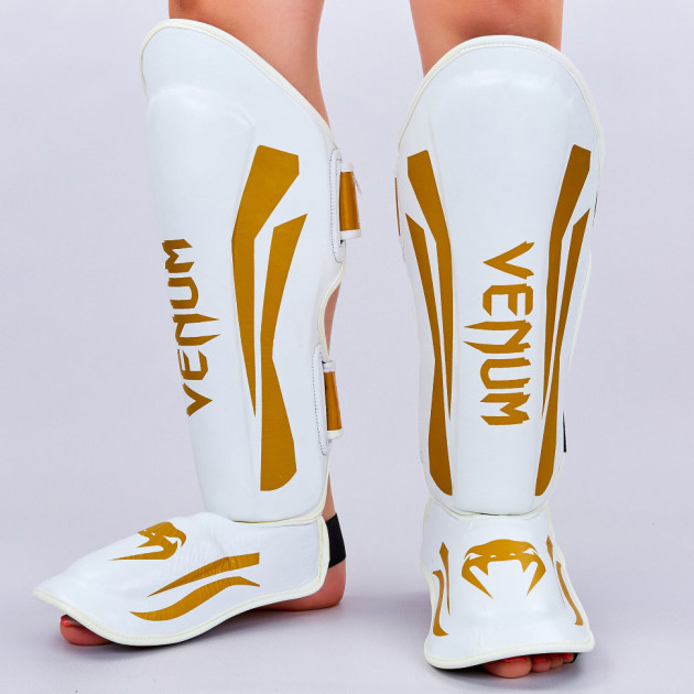 

Защита для голени и стопы Муай Тай, ММА, Кикбоксинг кожаная VNM ELITE VL-8314 (р-р XL/выше 182 см. , белый-золотой)