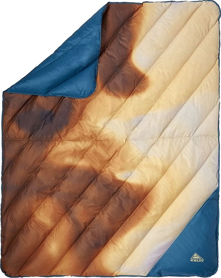 

Ковдра Kelty Galactic 183 х 140 см Бежевий з синім 35427021-CTH