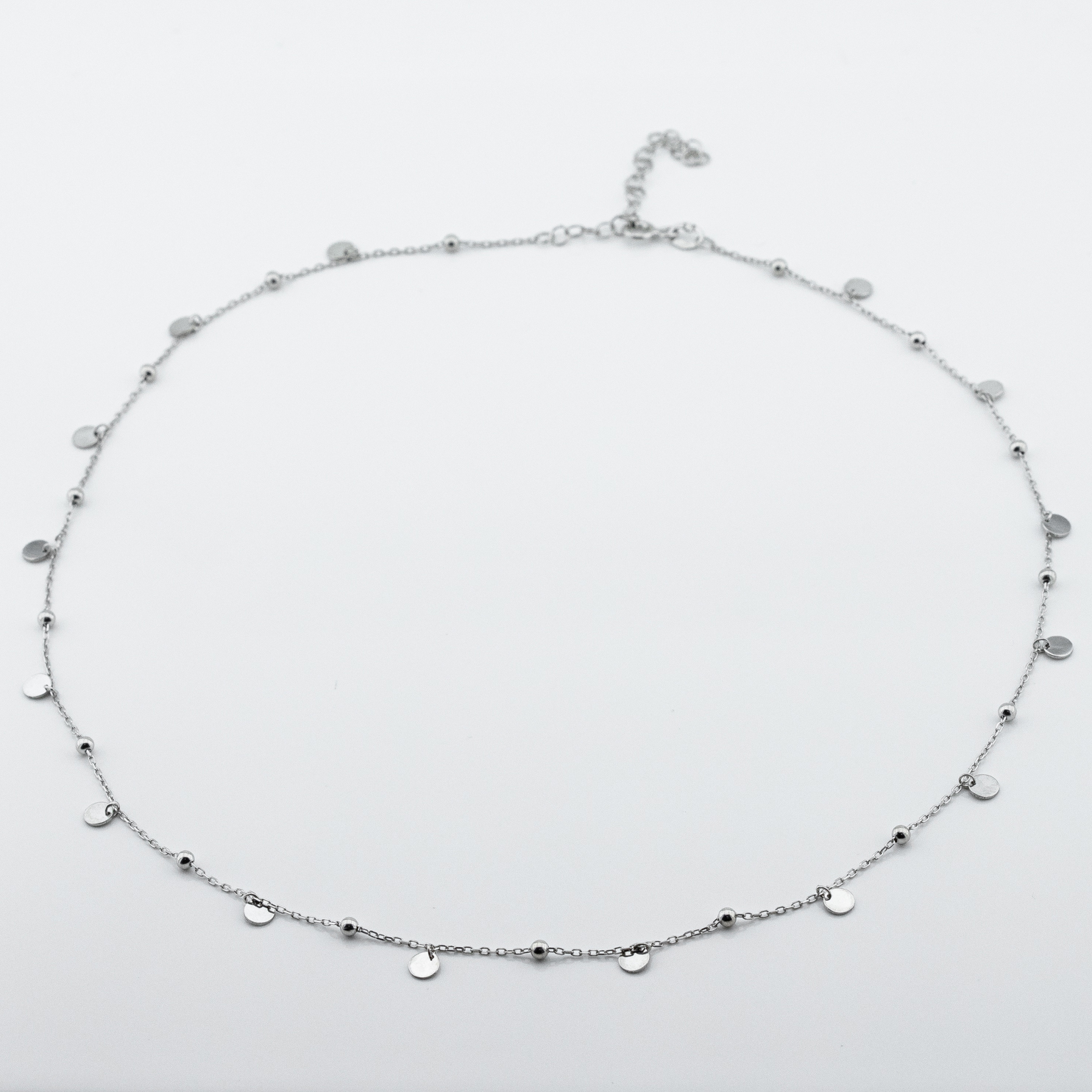 

Серебряное колье с шариками и монетками KO14224 Диамант, 45 размер