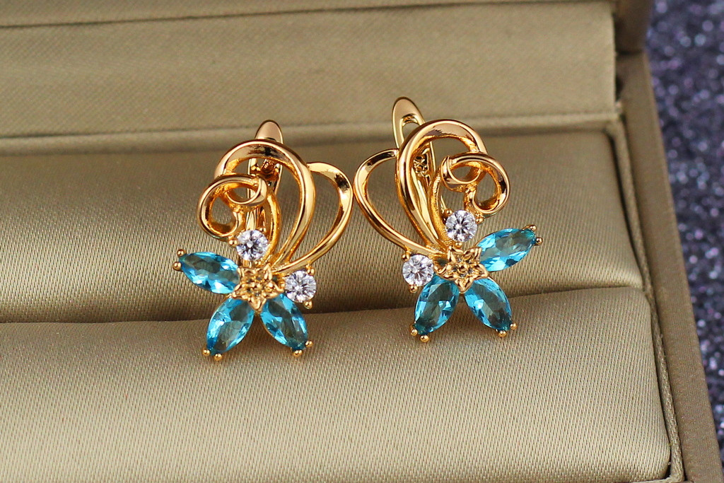 

Серьги Xuping Jewelry вихрь с голубыми камнями 1,8 см золотистые