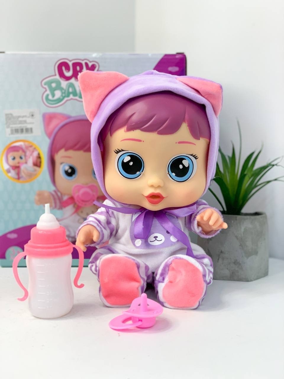 

Пупс Cry Babies, в костюме Кошечки, фиолетового цвета