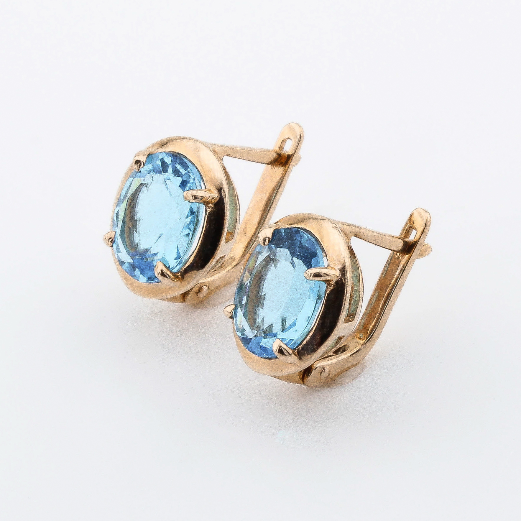 

Золотые серьги с синт. топазами 121009top Диамант