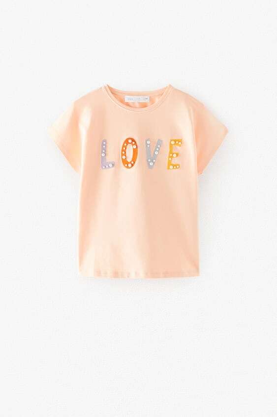

Футболка с жемчугом искусcтвенным Zara Р9050 140 см Персиковый (P-6910806230311)
