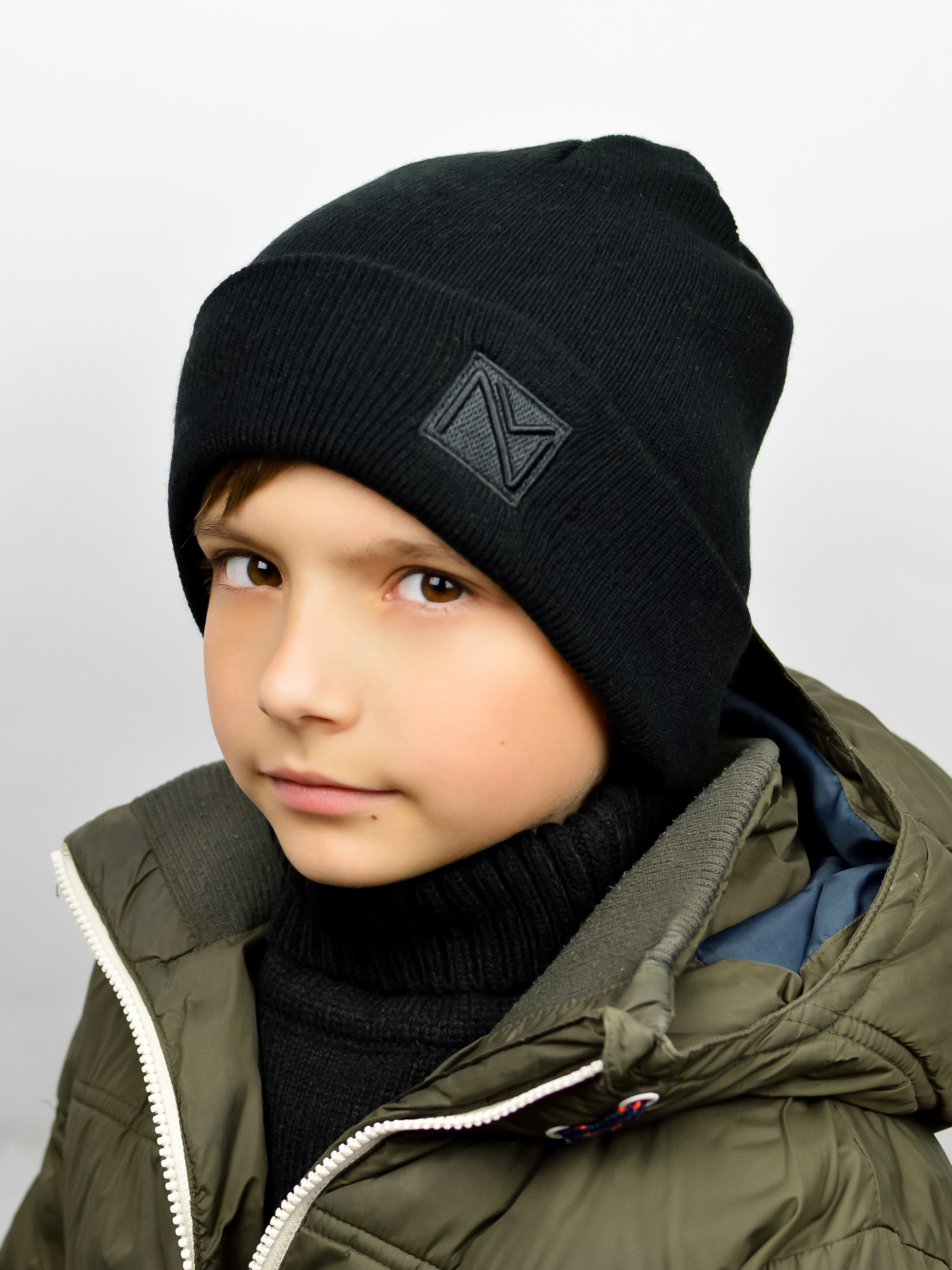 Акція на Дитяча зимова шапка-біні в'язана для хлопчика Noviti CZ027-B-01 50-54 Чорна від Rozetka