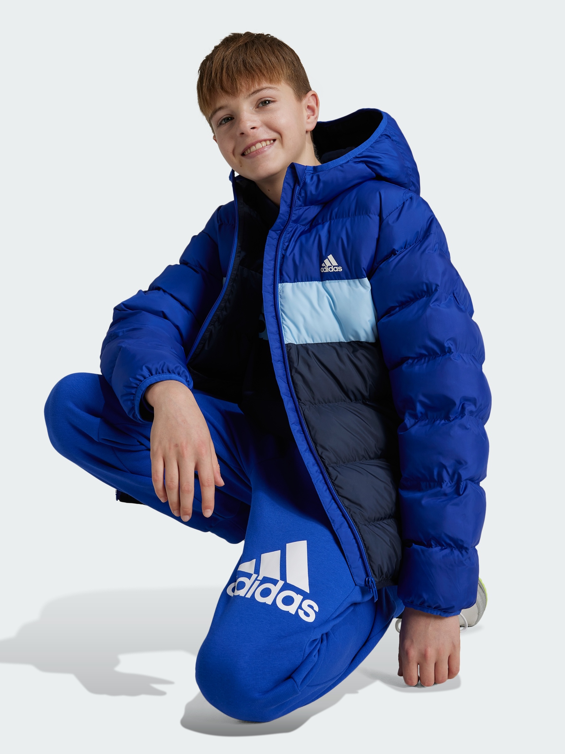 Акція на Підліткова зимова стьобана куртка для хлопчика Adidas J Sd Jkt IY6915 152 см Синя від Rozetka