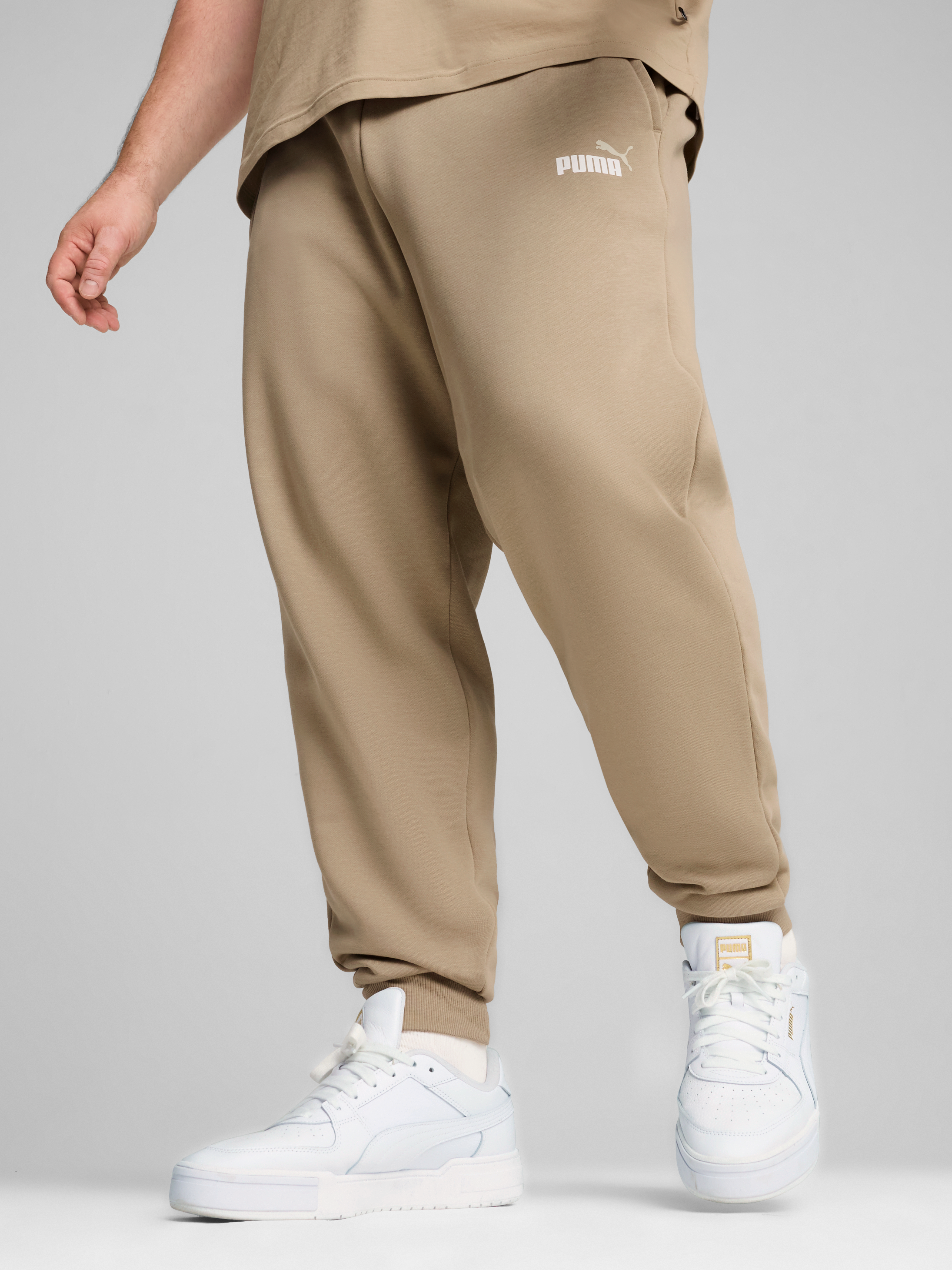 Акція на Спортивні штани чоловічі Puma Ess+ 2 Col Logo Pants 58676766 XXL Бежеві від Rozetka