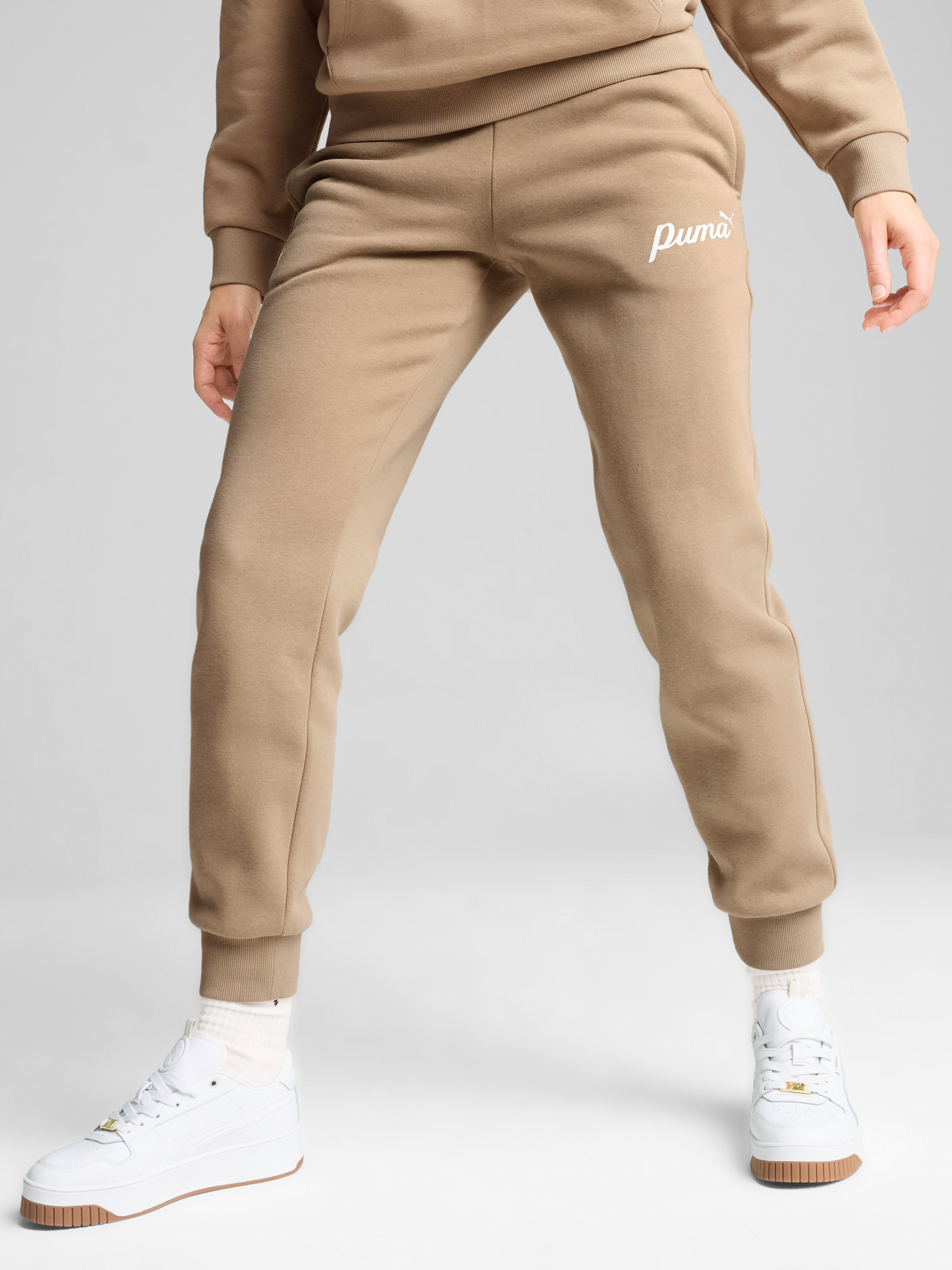 Акція на Спортивні штани на флісі жіночі Puma Ess+ Script Pants Fl 68153667 XS Бежеві від Rozetka