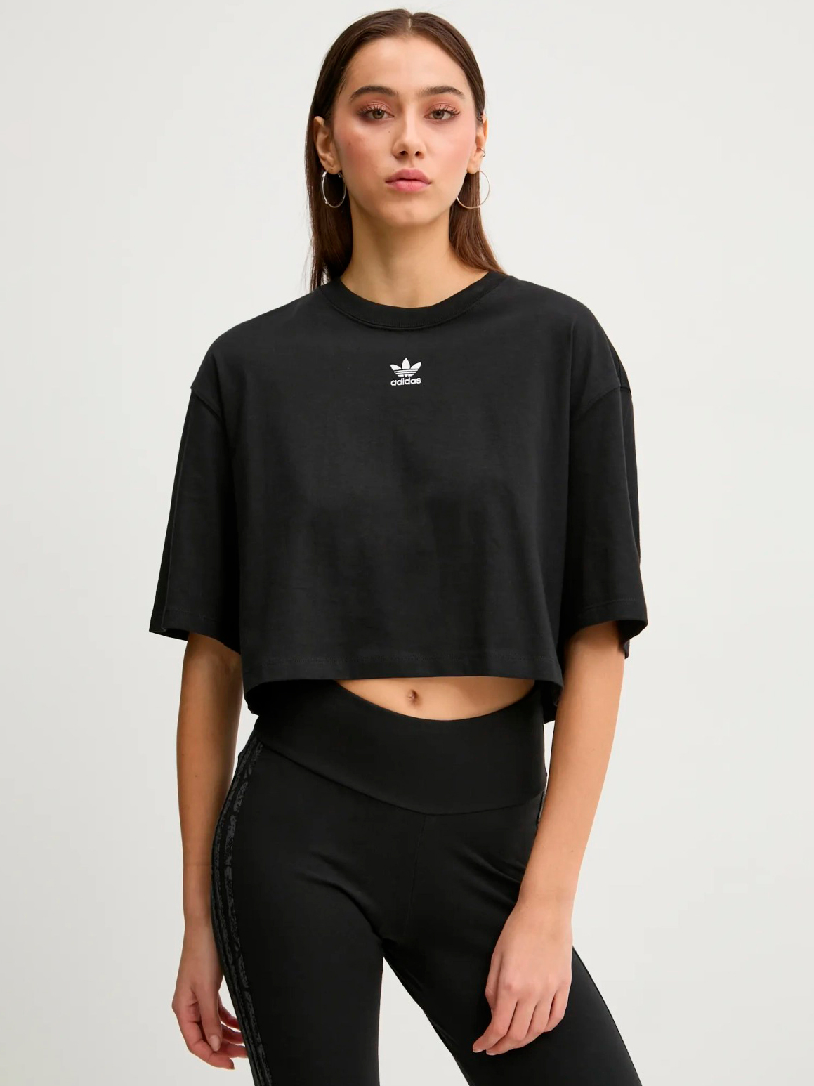 Акція на Футболка бавовняна коротка жіноча Adidas Ess Crop Tee IW5706 S Black від Rozetka