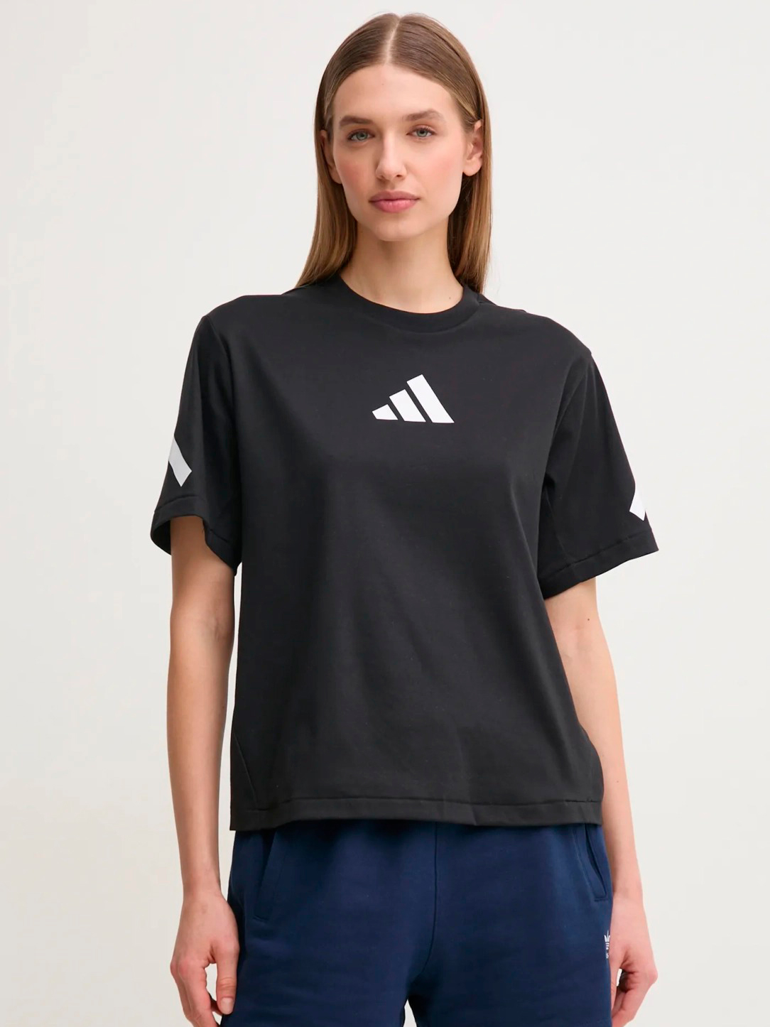 Акція на Футболка бавовняна жіноча Adidas W Z.N.E. Tee JJ4778 L Black/White від Rozetka