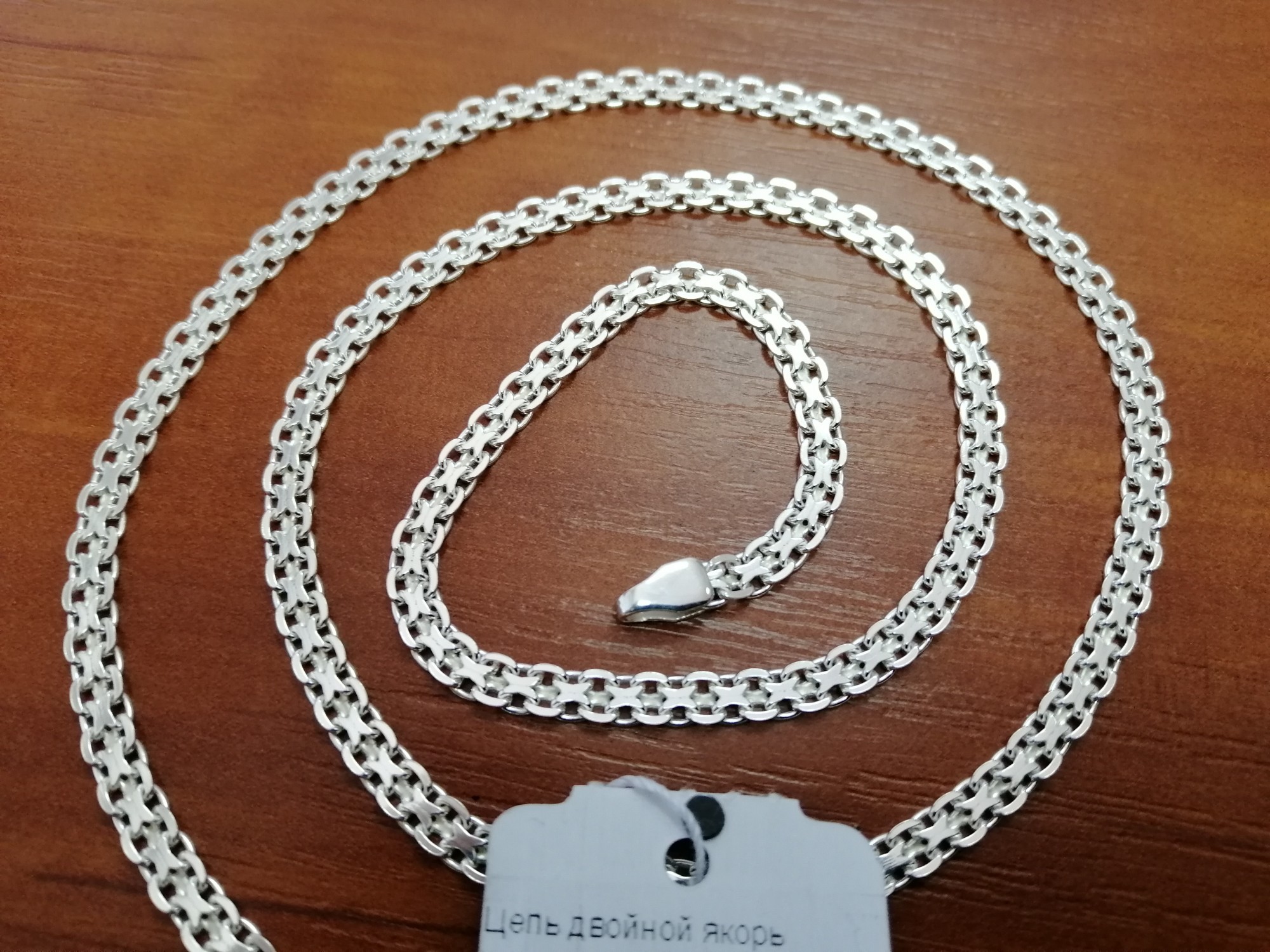 

Серебряная мужская цепь Двойной якорь 55см / 4мм белый